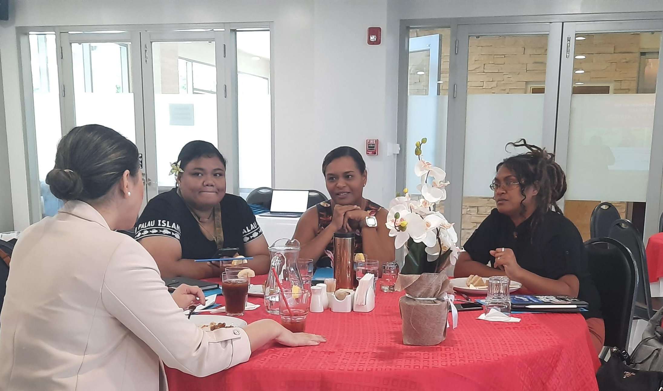 Four Women Sitting at a Table