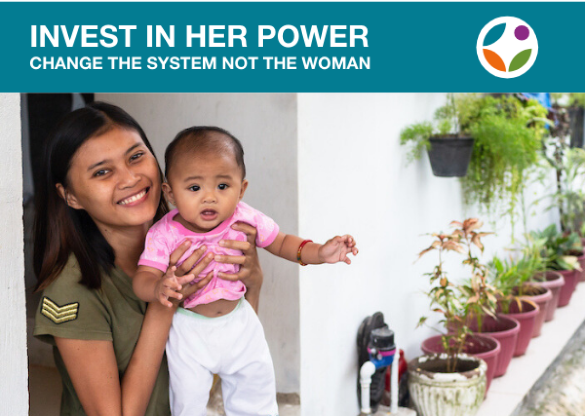 A young woman in the Philippines holds a baby while sitting outside on a low porch.