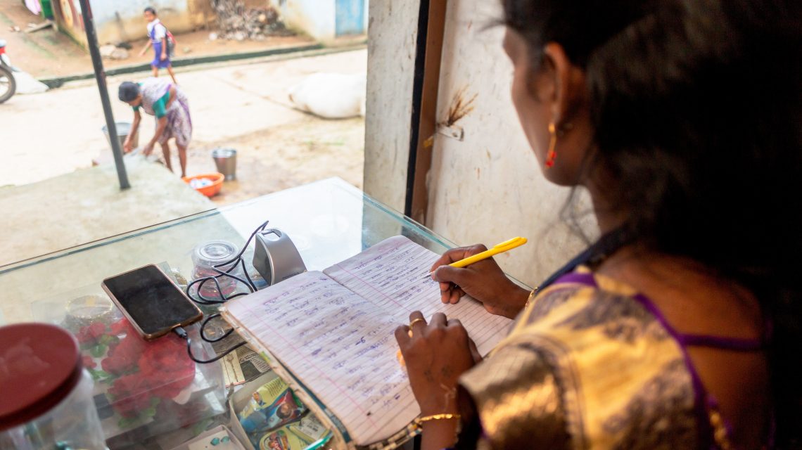 Woman doing books in Sara Sari shop