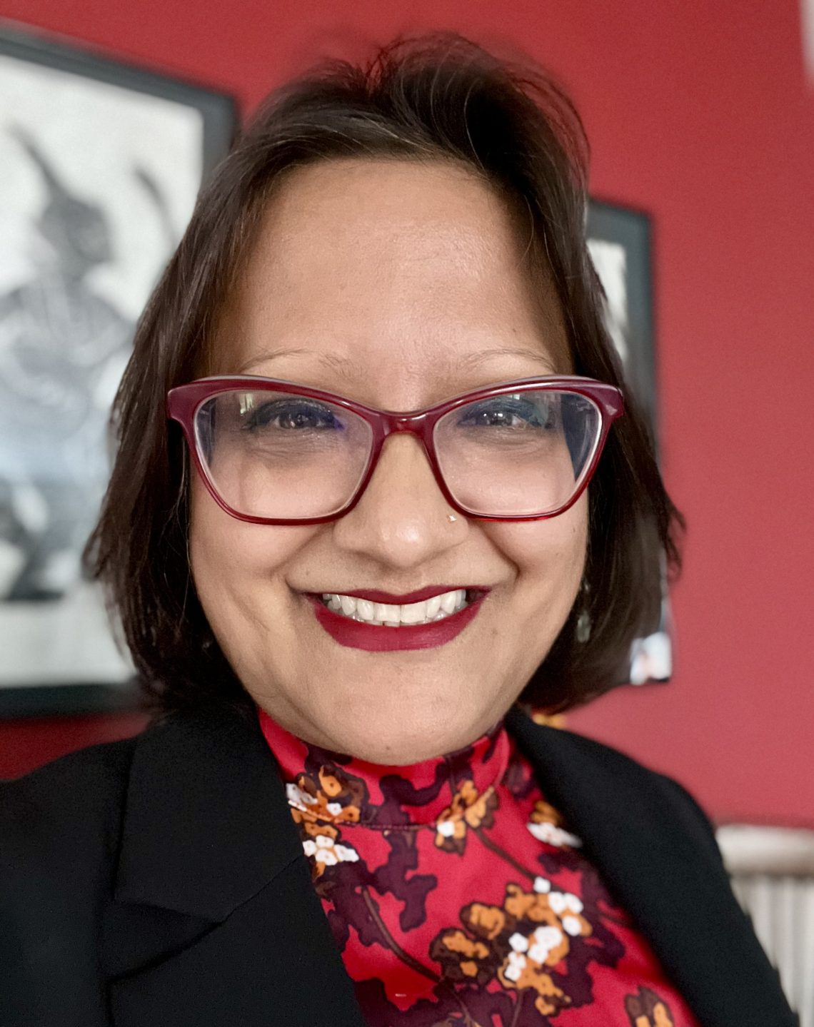 Photo of Grameen Foundation's new CEO, Sabrina Quaraishi. Sabrina is wearing glasses and smiling.