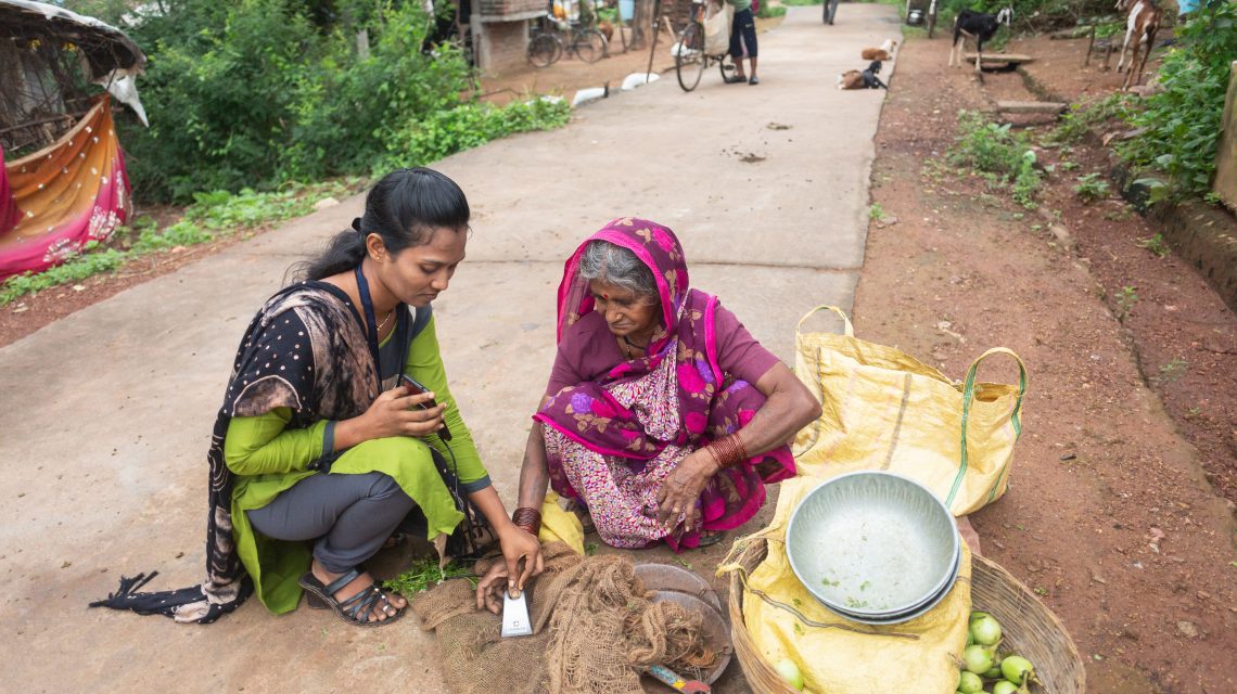 Mittra helping customer in street