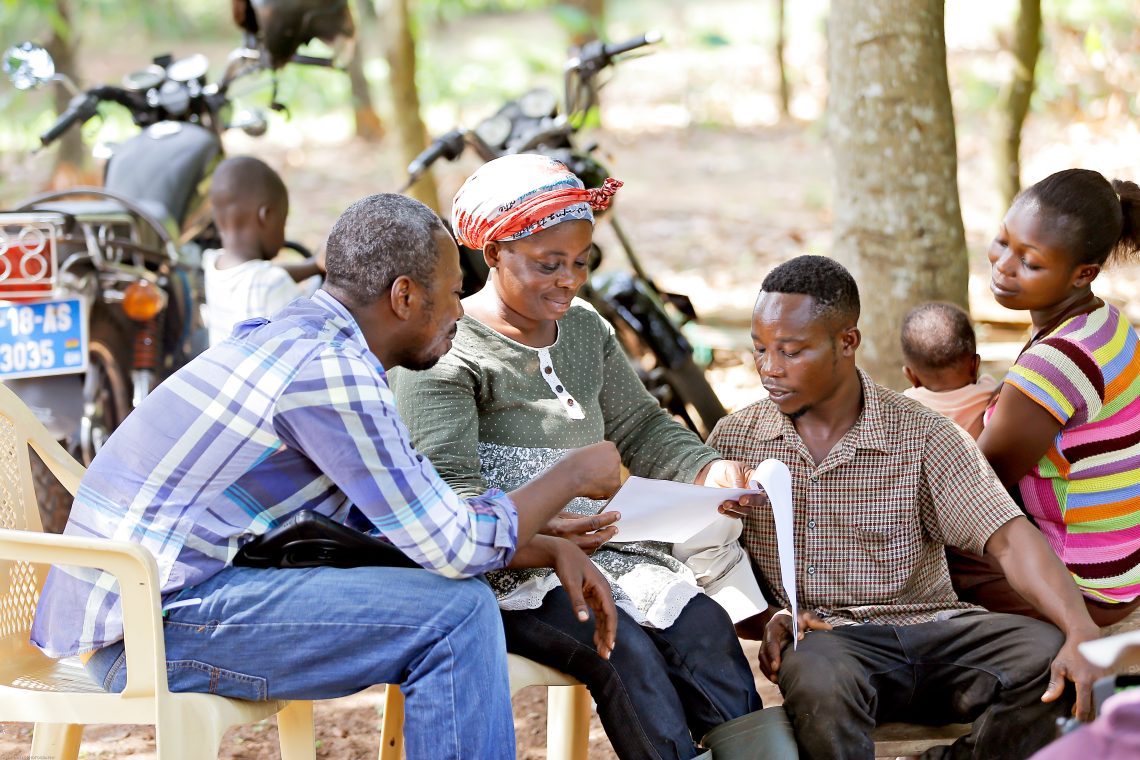 Martha with Selasse looking at plans