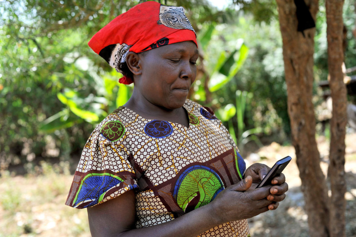 Woman farmer using mobile tools