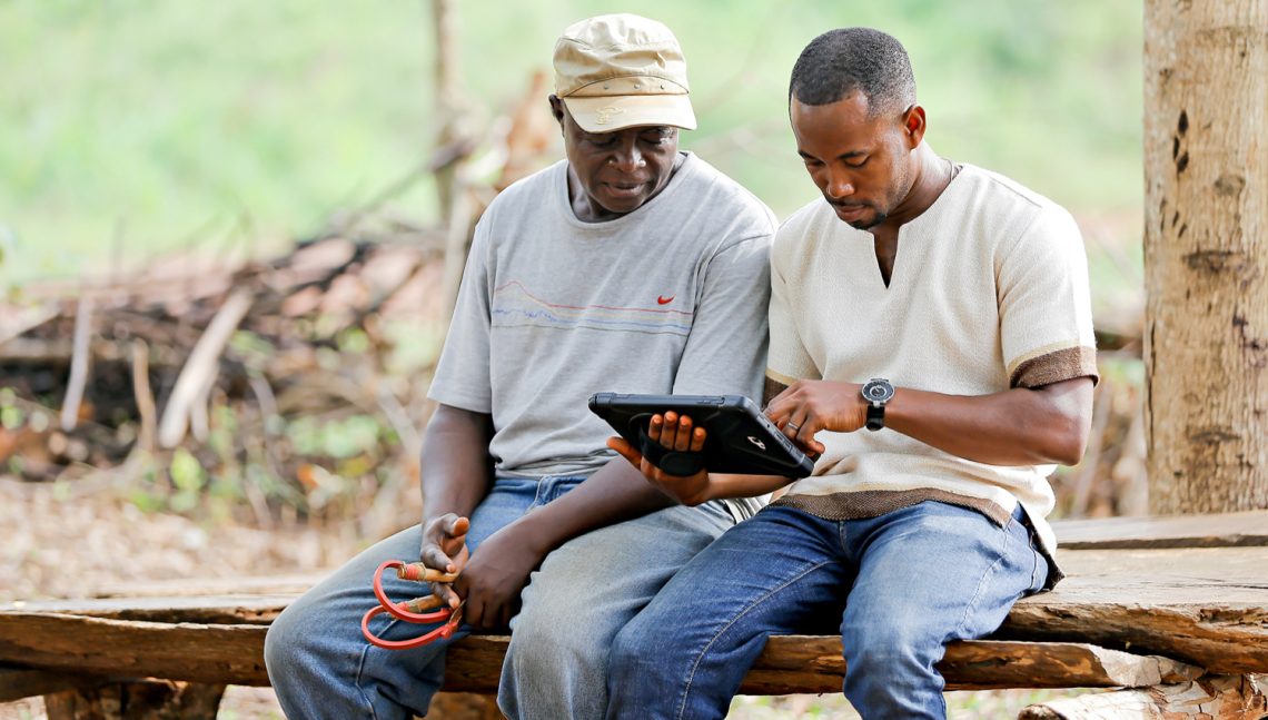 Farmer working with Grameen Digital Farming Agent