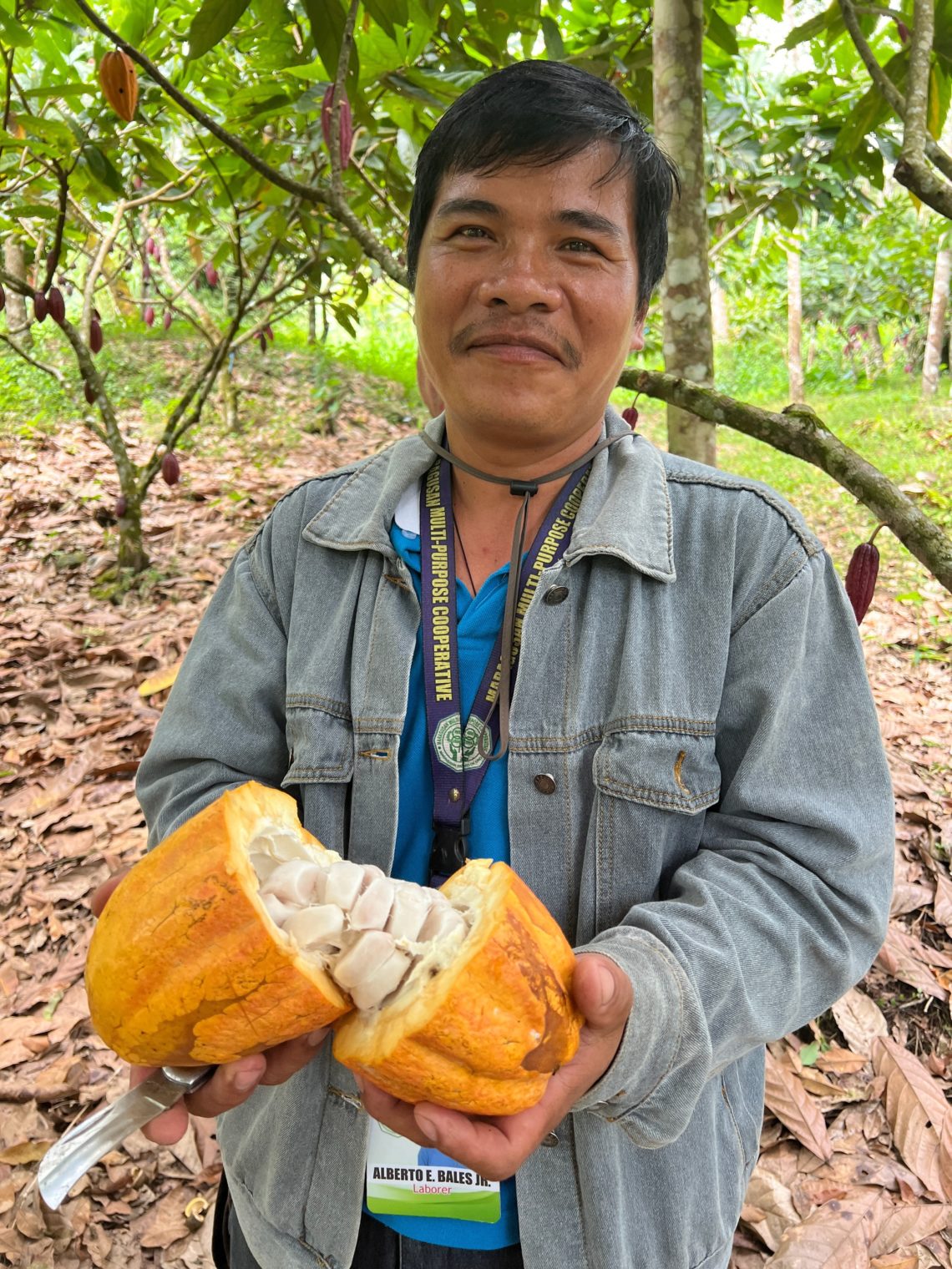 Man holding cut fruit