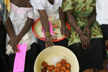 Three woman showing prepared food