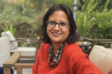 Image of Grameen Foundation President and CEO, Sabrina Quaraishi, sitting outside