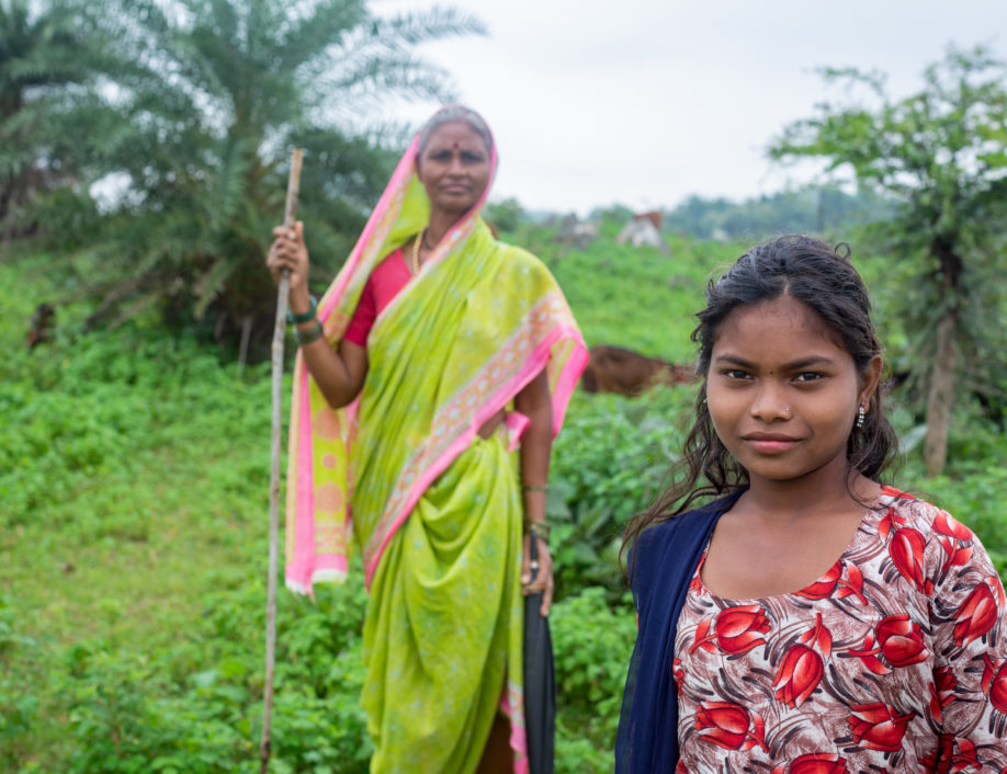 Indian woman and daughter strong and proud working in field