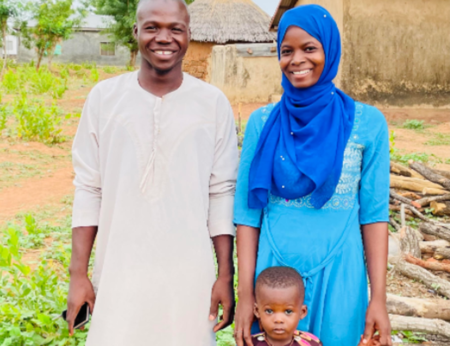 Yamba, Grameen Agent Yahaya, and their young son.